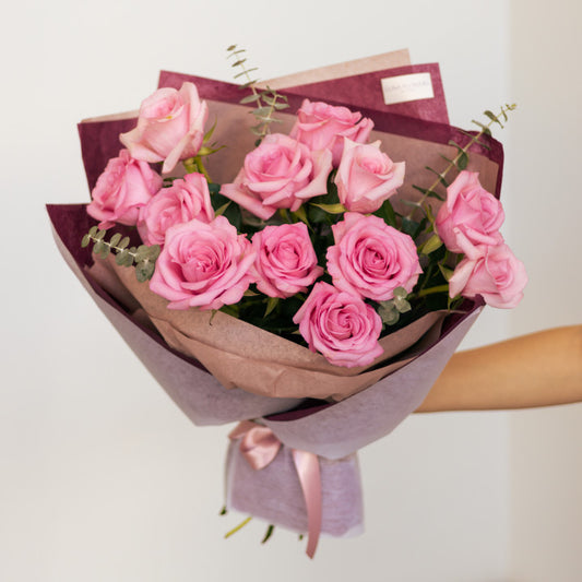 One Dozen Wrapped Pink Roses
